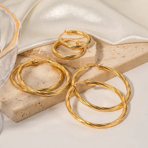 Σκουλαρίκια κρίκοι ατσάλινοι 3cm "στριφτοί", κίτρινο χρυσό 27022411