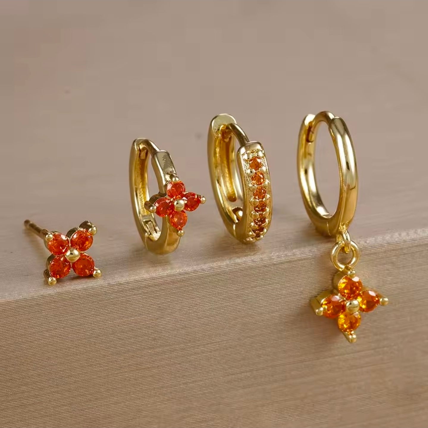 Σκουλαρίκια ατσάλινα σετ 4άδα με πορτοκαλί κρύσταλλο, σε κίτρινο  χρυσό, 2110259