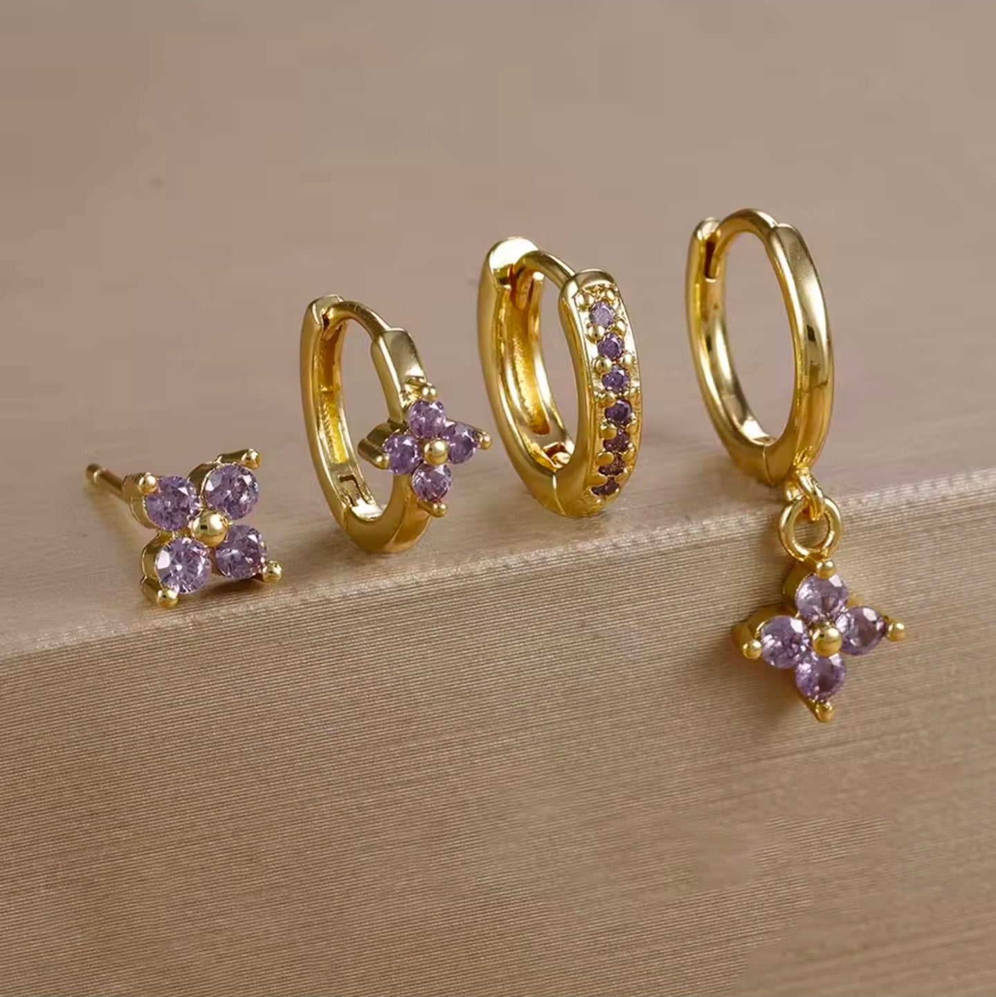 Σκουλαρίκια ατσάλινα σετ 4άδα με λιλά κρύσταλλο, σε κίτρινο  χρυσό, 21102512