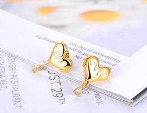 Σκουλαρίκια ατσάλινα, σχέδιο καρδιά με ζιργκόν, σε κίτρινο χρυσό